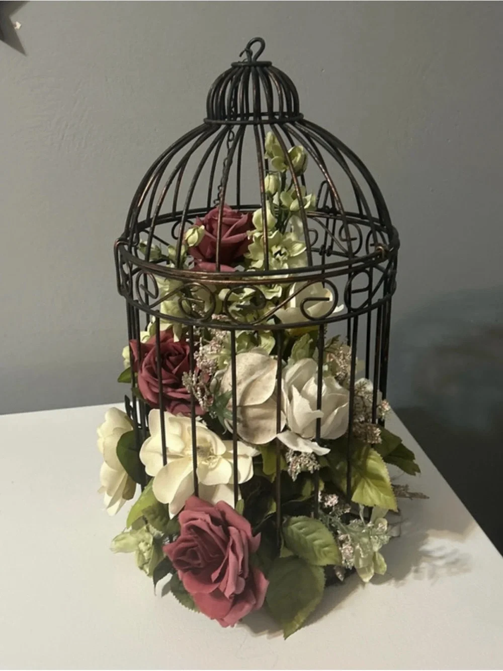 Black Metal Birdcage Floral Centerpiece with Burgundy and Cream Roses